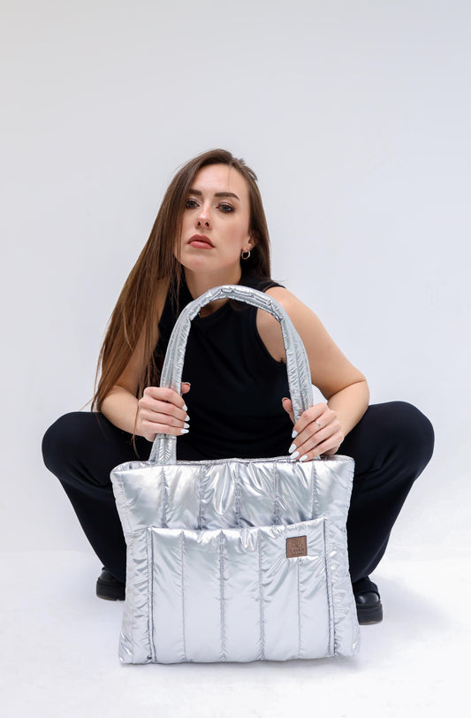 Silver puffer tote bag with external pocket